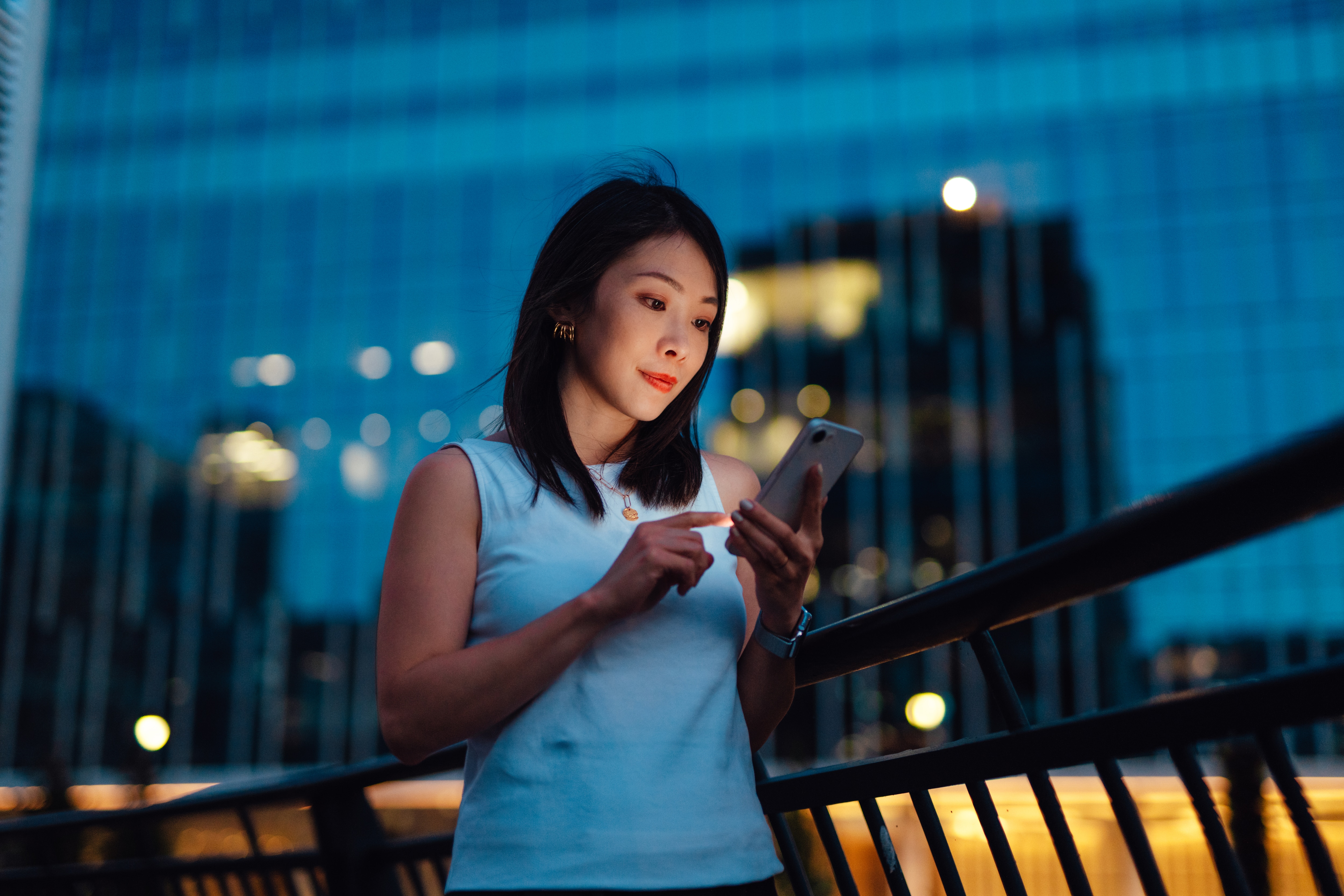 Woman using cellphone outdoors